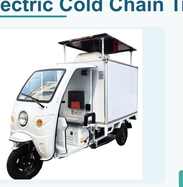 Compact electric cold tricycle parked at urban delivery point with refrigerated cargo
